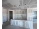 Open-concept kitchen area with drywall and a spacious layout ready for customization at 1635 Cane Bamboo Drive, St Cloud, FL 34771
