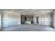 Open-concept floor plan with plasterboard walls, offering versatile layout options at 1635 Cane Bamboo Drive, St Cloud, FL 34771