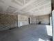 Spacious living room featuring concrete block and drywall, offering a versatile open space at 1635 Cane Bamboo Drive, St Cloud, FL 34771