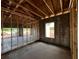 Interior showing cinder block walls and windows, wood frame of walls and ceiling at 1635 Cane Bamboo Drive, St Cloud, FL 34771
