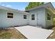 Backyard featuring a patio area, and a back door, providing a relaxing outdoor space with easy access to the house at 167 S Sheridan Ave, Deland, FL 32720