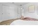 Bright bedroom featuring a closet, light wood floors, and natural light, creating a cozy and inviting space at 167 S Sheridan Ave, Deland, FL 32720