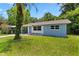 Charming single-story home boasts a well-manicured lawn and freshly painted exterior, creating an inviting curb appeal at 167 S Sheridan Ave, Deland, FL 32720
