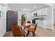 Bright and airy kitchen featuring stainless steel appliances and sleek white cabinets at 167 S Sheridan Ave, Deland, FL 32720