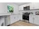 Well-appointed kitchen with stainless steel appliances and ample counter space at 167 S Sheridan Ave, Deland, FL 32720