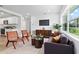 Bright living room featuring modern furniture, hardwood floors, and large windows at 167 S Sheridan Ave, Deland, FL 32720