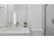Modern bathroom with vanity, toilet, and glass-enclosed shower featuring marble-look tile at 17 Cypress Run, Haines City, FL 33844