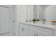 Bright bathroom featuring a double sink vanity with modern fixtures and ample counter space at 17 Cypress Run, Haines City, FL 33844