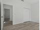 Bedroom with luxury vinyl plank flooring, closet, and neutral walls at 17 Cypress Run, Haines City, FL 33844