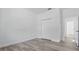 Bedroom with luxury vinyl plank flooring, closet, and neutral walls at 17 Cypress Run, Haines City, FL 33844