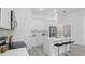 Clean, modern kitchen featuring stainless steel appliances, white cabinets, and eat-in island at 17 Cypress Run, Haines City, FL 33844