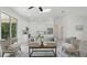 Spacious living area with large windows and sliding glass door bringing the outside in at 17 Cypress Run, Haines City, FL 33844