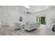 Bright living room features sleek floors, modern furniture, and sliding door access at 17 Cypress Run, Haines City, FL 33844
