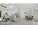 Stylish interior showcasing an open-concept layout, blending living, dining, and kitchen areas at 17 Cypress Run, Haines City, FL 33844