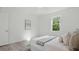 Inviting main bedroom with a plush bed, soft decor and a sunny window at 17 Cypress Run, Haines City, FL 33844