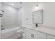 Modern bathroom featuring a tiled shower, sleek vanity, and contemporary fixtures at 17315 Sw 26Th Terrace Rd, Ocala, FL 34473