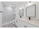 Modern bathroom showcasing double sinks, sleek fixtures, and a beautifully tiled walk-in shower at 17315 Sw 26Th Terrace Rd, Ocala, FL 34473