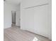 Bedroom featuring closet and wood-look flooring at 17315 Sw 26Th Terrace Rd, Ocala, FL 34473