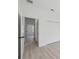 Hallway view showing doors, closets and stylish flooring throughout the home's interior at 17315 Sw 26Th Terrace Rd, Ocala, FL 34473
