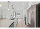 Modern kitchen boasts stainless steel appliances, a center island, and sleek, black fixtures at 17315 Sw 26Th Terrace Rd, Ocala, FL 34473