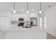 Bright kitchen features a large island, white cabinetry, and stainless steel appliances at 17315 Sw 26Th Terrace Rd, Ocala, FL 34473