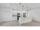 Bright kitchen featuring stainless appliances, white cabinets, and a center island with pendant lighting at 17315 Sw 26Th Terrace Rd, Ocala, FL 34473