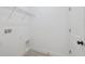 Well-lit laundry room featuring modern fixtures and ample space, enhancing functionality at 17315 Sw 26Th Terrace Rd, Ocala, FL 34473