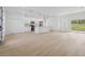 Living room and kitchen combo has modern fixtures, stainless appliances, and slider to backyard at 17315 Sw 26Th Terrace Rd, Ocala, FL 34473