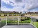 Balcony view showing the building's exterior and lush landscaping at 17322 Chateau Pine Way, Clermont, FL 34711