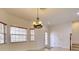 Spacious living room with tiled floors, natural light, and decorative chandelier at 17322 Chateau Pine Way, Clermont, FL 34711