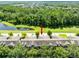 Aerial view of townhome with pond and nature views at 2021 Sweet Birch Ln, Orlando, FL 32828