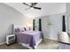 Relax in this bedroom featuring a large window, comfortable bed, and neutral paint at 2021 Sweet Birch Ln, Orlando, FL 32828