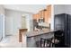 Kitchen with breakfast bar, stainless steel appliances and pantry at 2021 Sweet Birch Ln, Orlando, FL 32828