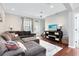 Comfortable living room featuring wood flooring and lots of natural light at 2021 Sweet Birch Ln, Orlando, FL 32828