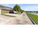 A row of townhomes with driveways and lawns lining the street at 2021 Sweet Birch Ln, Orlando, FL 32828