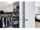 The walk-in closet features ample storage with shelving and hanging space, perfect for organization at 2021 Sweet Birch Ln, Orlando, FL 32828