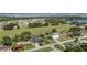 Aerial view of the property showcasing its location near a lake and a green space at 209 7Th S St, Haines City, FL 33844