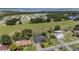 Aerial view of the home showing its location in a vibrant lakeside community at 209 7Th S St, Haines City, FL 33844