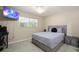 Neutral bedroom featuring tile floors, a ceiling fan, and a flat screen television at 209 7Th S St, Haines City, FL 33844