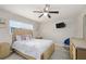 Cozy bedroom with bright light showcasing neutral walls and modern furnishings at 209 7Th S St, Haines City, FL 33844