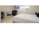 This bedroom features a large window and a flat screen television for entertainment at 209 7Th S St, Haines City, FL 33844