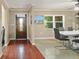 The foyer and dining area offers updated flooring and access to the solid wood front door at 209 7Th S St, Haines City, FL 33844