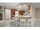 Kitchen featuring marble countertops, breakfast bar seating, and dark wood cabinetry at 209 7Th S St, Haines City, FL 33844