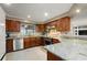 Kitchen featuring stainless steel appliances, marble countertops, and dark wood cabinetry at 209 7Th S St, Haines City, FL 33844