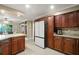 Spacious kitchen showcasing custom cabinets, stainless appliances, and island with barstool seating at 209 7Th S St, Haines City, FL 33844