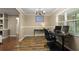 A comfortable office space features warm-toned walls and stylish laminate flooring at 209 7Th S St, Haines City, FL 33844