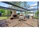 Outdoor kitchen featuring a fireplace, built-in grill and ample seating for guests at 209 7Th S St, Haines City, FL 33844