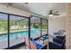 Enjoy this outdoor space complete with a refreshing pool, a ceiling fan and ample seating at 209 7Th S St, Haines City, FL 33844