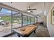 Pool room featuring a billiard table, ceiling fans and beautiful views of the backyard and pool at 209 7Th S St, Haines City, FL 33844