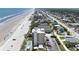 Aerial view of a beachfront condo with manicured lawns, swimming pool, and convenient beach access at 2121 Hill St # 7B, New Smyrna Beach, FL 32169